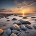 Stone beach by the sea at sunset. Stones in the foreground. Long exposure Royalty Free Stock Photo