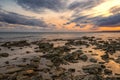 Stone beach at sunset. Twilight sea and sky. Dramatic sky and clouds. Nature landscape Royalty Free Stock Photo