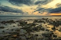 Stone beach at sunset. Twilight sea and sky. Dramatic sky and clouds. Royalty Free Stock Photo