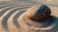 Stone on a bed of sand creating tranquil ripples