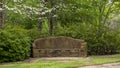 Stone bench constructed by the New Deal Works Progress Administration in the 1930`s in Turtle Creek Park, Dallas, Texas. Royalty Free Stock Photo