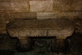 Stone bench at the entrance in the Basilica of Saint Mary Major in Bonifacio, Corsica