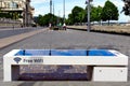 stone bench in public park with PV solar panel built in. free WiFi internet connection point Royalty Free Stock Photo