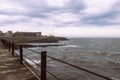 Heugh breakwater pier in stormy, cloudy weather seascape