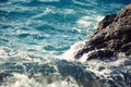 Stone breakwater with breaking waves. Royalty Free Stock Photo