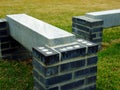 Stone and brick benches in grass