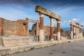 Stone and brick columns in The Forum in the archaeological excavations of Roman Pompeii near Naples, Campania, Italy Royalty Free Stock Photo