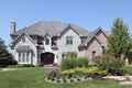 Stone and brick home with arched doorway Royalty Free Stock Photo