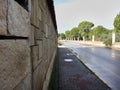 Stone, Brick wall and fence on the city street in a day