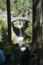 Stone bridge crosses steps of Christine falls