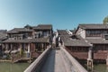 Stone Bridge Leading to Chinese Houses Royalty Free Stock Photo