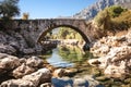 Stone bridge over a calm river stream in the park