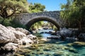 Stone bridge over a calm river stream in the park