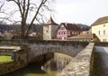 a stone bridge over the Kocher river in the beautiful historic old town of Schwabisch Hall in Germany Royalty Free Stock Photo
