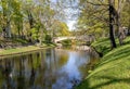 Stone bridge over Riga river canal in Riga central city park Royalty Free Stock Photo