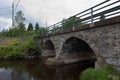 Stone bridge over river. Royalty Free Stock Photo