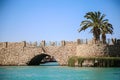 Stone bridge over the sea channel Royalty Free Stock Photo