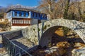 Stone bridge over small river in Moushteni near Kavala, Greece Royalty Free Stock Photo