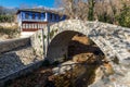 Stone bridge over small river in Moushteni near Kavala, Greece Royalty Free Stock Photo