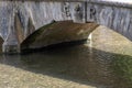 Stone bridge over stream celebrating Queens Coronation Royalty Free Stock Photo