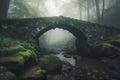 a stone bridge over a stream in a foggy forest Royalty Free Stock Photo