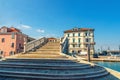 Stone bridge Ponte di Vigo with stairs across Vena water canal and old buildings in historical centre of Chioggia