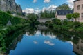 Stone bridge reflecting in the Alzette river Royalty Free Stock Photo