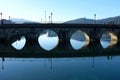 Stone bridge reflection under clear sky Royalty Free Stock Photo