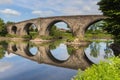 The stone bridge in Stirling reflecting in the river Forth Royalty Free Stock Photo