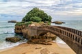 Stone bridge to the Rocher du Basta, the landmark of the coast of Biarritz, France.
