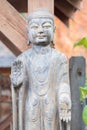 Buddhist monk statue with hands facing outward Royalty Free Stock Photo