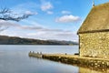 Stone building near the edge of a lake Royalty Free Stock Photo