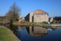 Stone building and reflection Lancaster Canal