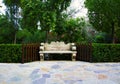 A Stone Built Bench in a Beautiful Green Garden