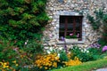 Stone-built house and flowers Royalty Free Stock Photo