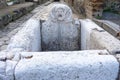 stone bust of ancient city fountain in Herculaneum archaeological park, Naples, Italy.