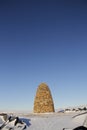 Stone cairn commemorating the Maud boat that were build by Norwegians, located near Cambridge Bay Royalty Free Stock Photo