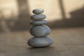 Stone cairn on striped grey white background, five stones tower, simple poise stones, simplicity harmony and balance Royalty Free Stock Photo