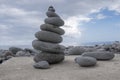 Stone cairn tower, poise stones, rock zen sculpture, light grey pebbles Royalty Free Stock Photo