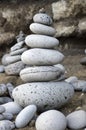 Stone cairn tower, poise stones, rock zen sculpture, light grey pebbles Royalty Free Stock Photo