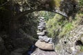 Stone cairn under the bridge, Rabacal, Madeira island, Portugal