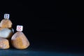 dice on stone Cairn and black backgrouund Royalty Free Stock Photo