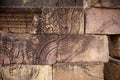 Stone carved bas-relief of Banteay Srei temple in Angkor Wat, Cambodia. Traditional bas-relief on cambodian hindu temple Royalty Free Stock Photo