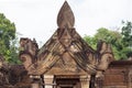 Stone carved bas-relief of Banteay Srei temple in Angkor Wat, Cambodia. Traditional bas-relief on portal of hindu temple Royalty Free Stock Photo