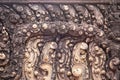 Stone carved bas-relief of Banteay Srei temple in Angkor Wat, Cambodia. Traditional bas-relief closeup photo. Royalty Free Stock Photo