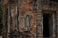 Stone carved bas-relief of Preah Koh temple in Roluos complex, Cambodia. Temple entrance bas-relief restoration. Royalty Free Stock Photo