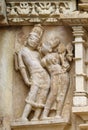 Stone carved erotic bas relief in Hindu temple in Khajuraho, Ind Royalty Free Stock Photo