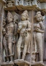 Stone carved erotic bas relief in Hindu temple in Khajuraho, India. Royalty Free Stock Photo