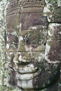 Stone carved face at the wall of the Bayon temple in Siem Reap, Cambodia.