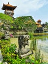 A stone-carved figure of a monkey at a balinese hindu temple on Bali island in Indonesia